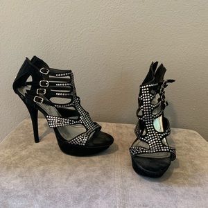 Black platform shoes with silver studs and buckles